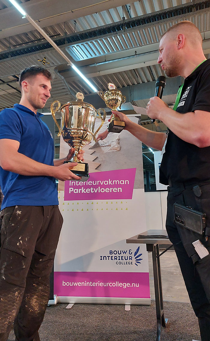 Nederlands Kampioen Parketleggen 2025 bij de senioren Łukasz Polak links